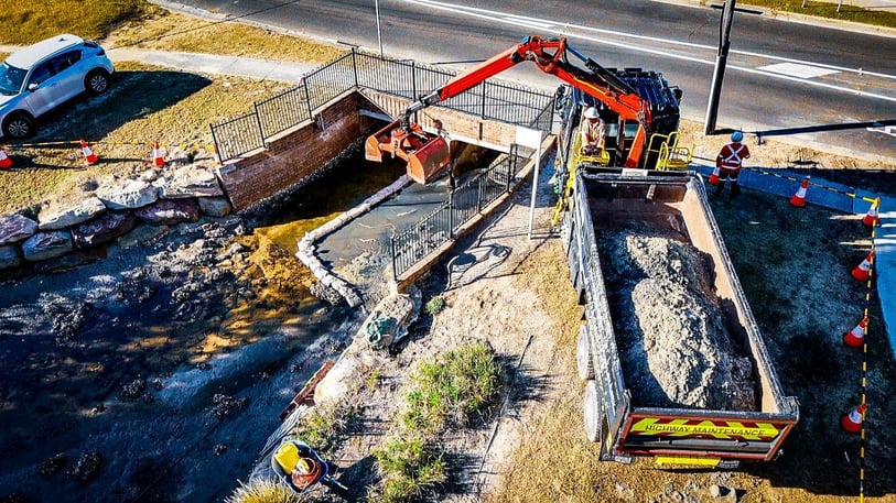 Drone shot of Truck next to Culvert