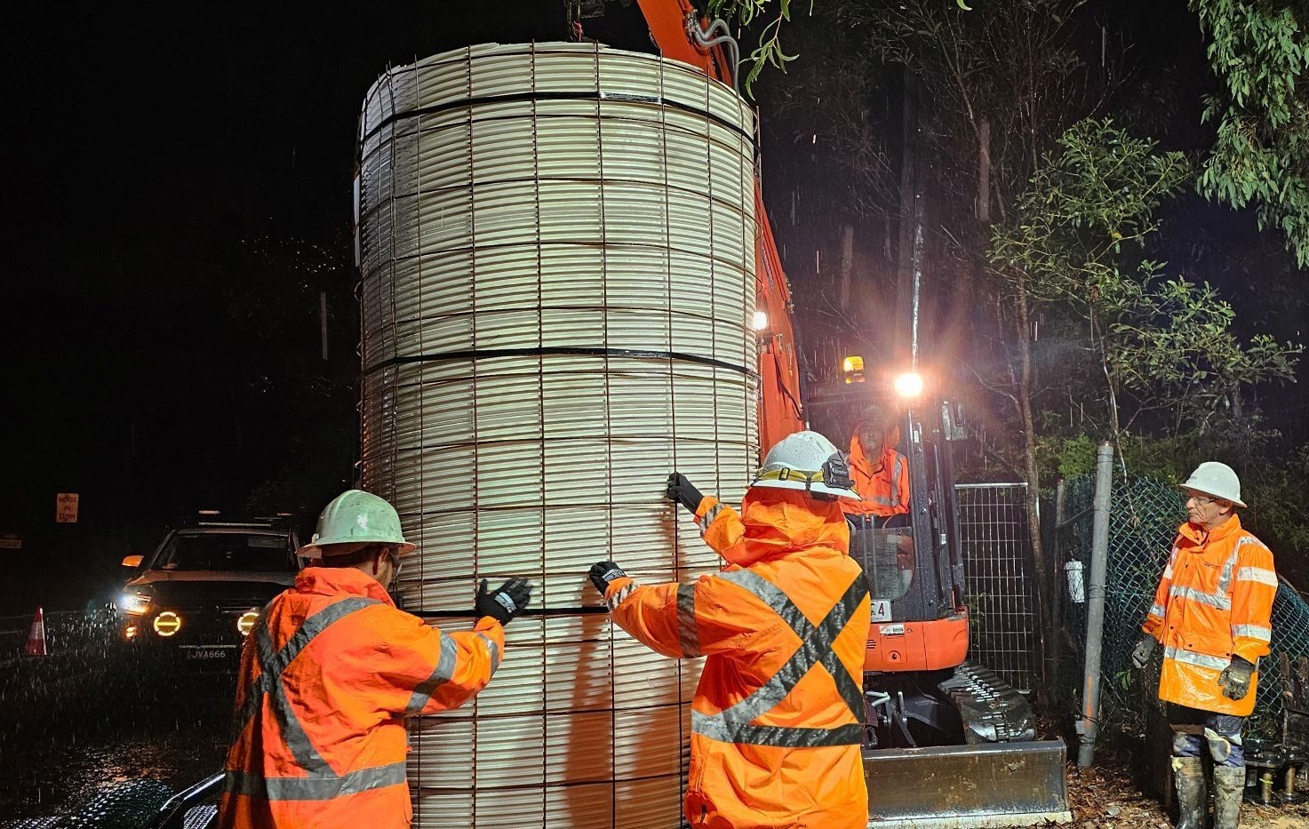 Operators moving Panel Lok Lining for Maintenance Hole Rehab