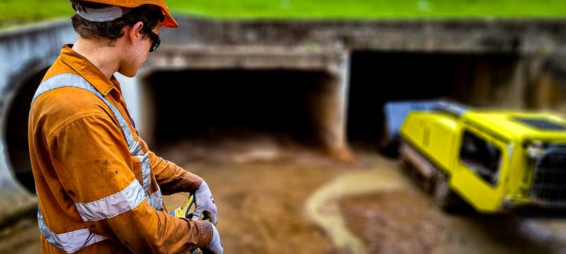 operator-controlling-microtraxx-culvert-cleaner